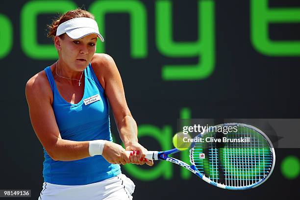 Agnieszka Radwanska of Poland returns a shot against Venus Williams of the United States during day eight of the 2010 Sony Ericsson Open at Crandon...