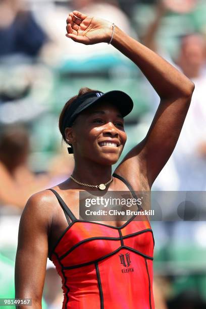 Venus Williams of the United States celebrates after defeating Agnieszka Radwanska of Poland during day eight of the 2010 Sony Ericsson Open at...