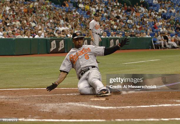 Baltimore Orioles Melvin Mora slides into home plate against the Tampa Bay Devil Rays July 23, 2006 in St. Petersburg. The Orioles defeated the Rays...