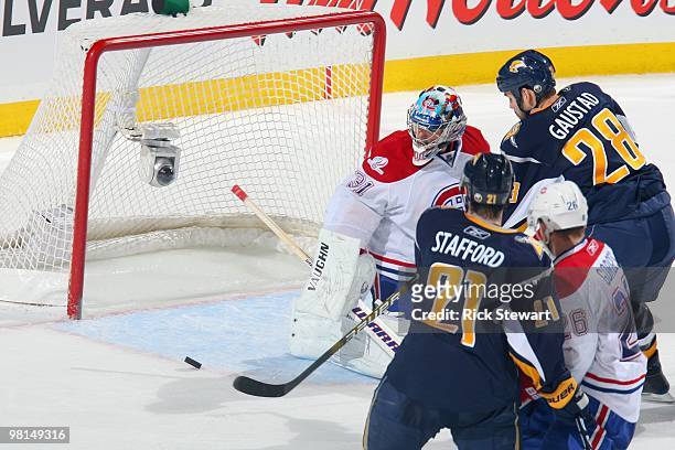 Goalie Carey Price of the Montreal Canadiens tries to block the net against Paul Gaustad of the Buffalo Sabres at HSBC Arena on March 24, 2010 in...