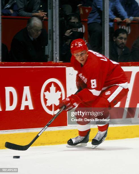 Igor Larionov of the Detroit Red Wings skates with the puck against the Montreal Canadiens in the 1990's at the Montreal Forum in Montreal, Quebec,...