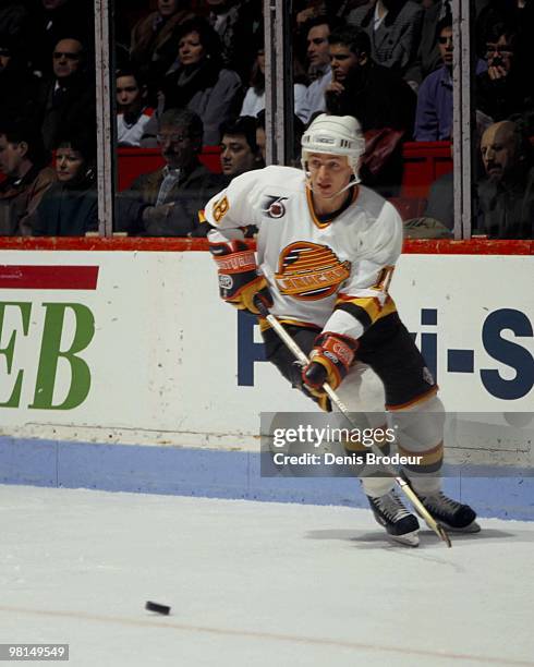 Igor Larionov of the Vancouver Canucks skates against the Montreal Canadiens in the early 1990's at the Montreal Forum in Montreal, Quebec, Canada.