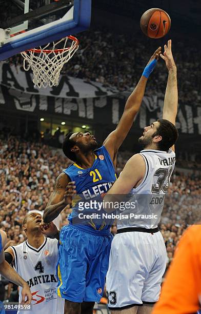 Slavko Vranes of Partizan Belgrade in action against D'or Fischer of Maccabi Electra during the Euroleague Basketball 2009-2010 Play Off Game 3...