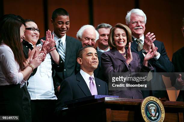 President Barack Obama signs the Health Care and Education Reconciliation Act of 2010 at Northern Virginia Community College with House Speaker Nancy...