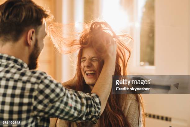 let me fix your hairstyle! - tousled hair man stock pictures, royalty-free photos & images