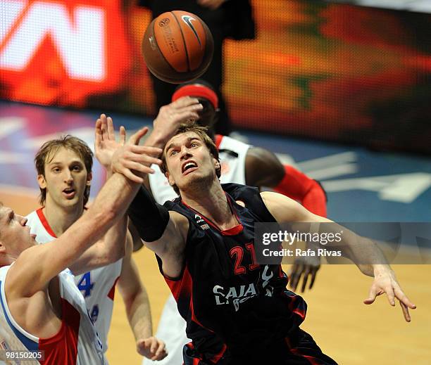 Tiago Splitter of Caja Laboral and Zoran Planinic of CSKA Moscow in action during the Euroleague Basketball 2009-2010 Play Off Game 3 between Caja...