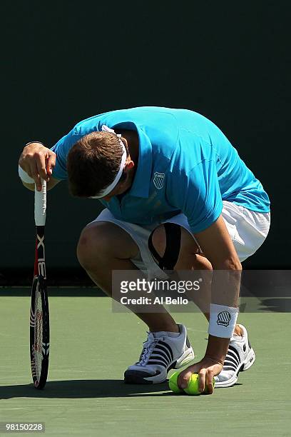 Mardy Fish of the United States reacts after an injury while playing against Mikhail Youzhny of Russia during day eight of the 2010 Sony Ericsson...