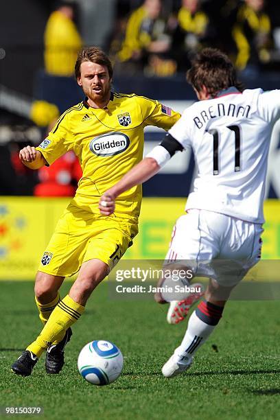 Midfielder Eddie Gaven of the Columbus Crew defends against midfielder Jim Brennan of the Toronto FC on March 27, 2010 at Crew Stadium in Columbus,...