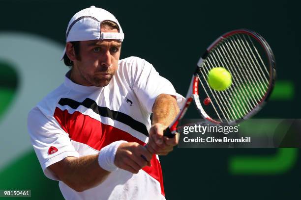 Benjamin Becker of Germany returns a shot against Andy Roddick of the United States during day eight of the 2010 Sony Ericsson Open at Crandon Park...