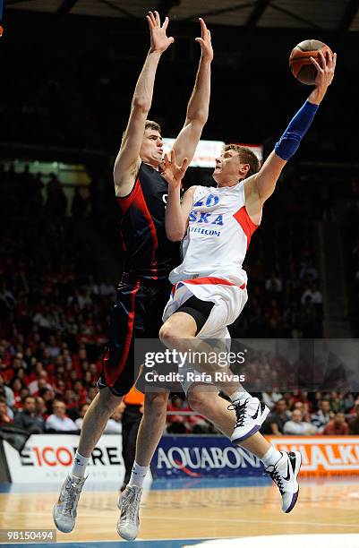 Andrey Vorontsevich, #20 of CSKA Moscow competes with Stanko Barac, #42 of Caja Laboral during the Euroleague Basketball 2009-2010 Play Off Game 3...