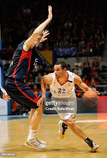 Trajan Langdon, #21 of CSKA Moscow competes with Stanko Barac, #42 of Caja Laboral during the Euroleague Basketball 2009-2010 Play Off Game 3 between...