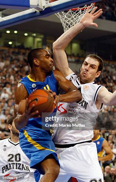 Aleksandar Maric of Partizan Belgrade competes with Alan Anderson of Maccabi Electra Tel Aviv during the Euroleague Basketball 2009-2010 Play Off...