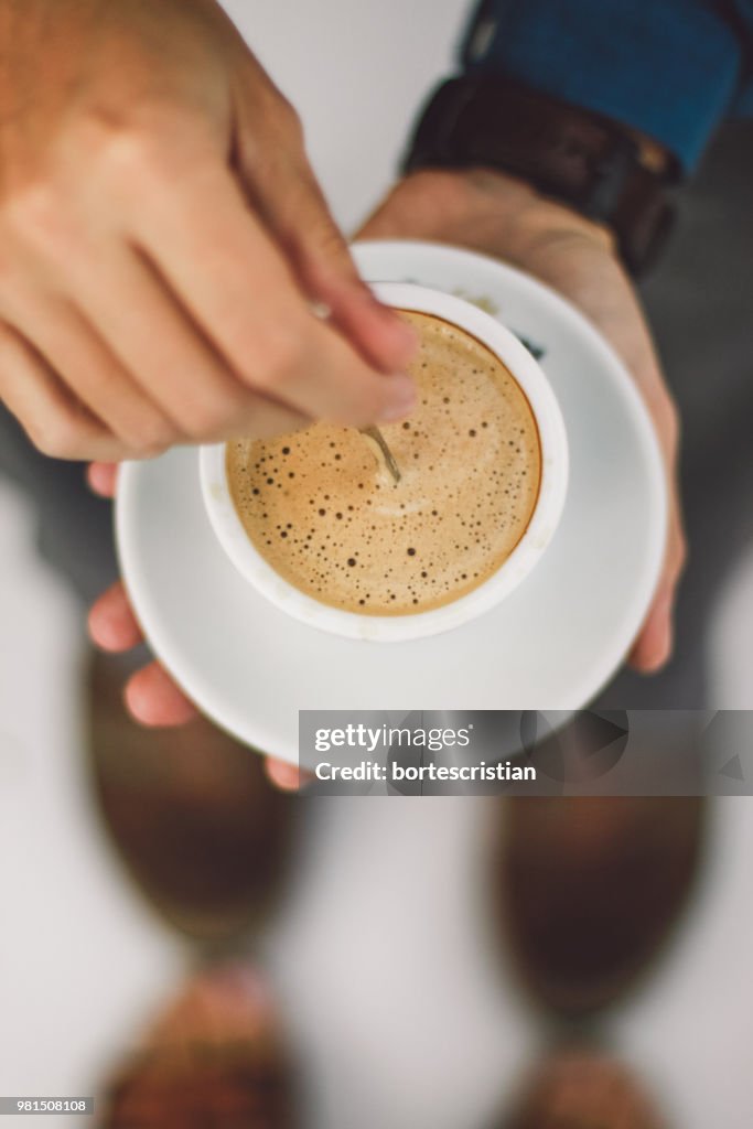 Close-Up Of Hand Holding Coffee Cup