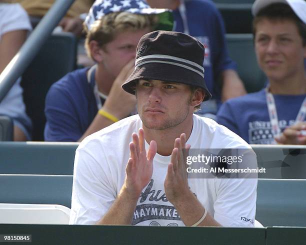Andy Roddick watches Mardy Fish win the second match in the 2004 David Cup semifinal September 24, 2004 at Daniel Island, South Carolina. Fish's...