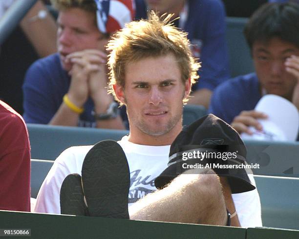 Andy Roddick watches Mardy Fish win the second match in the 2004 David Cup semifinal September 24, 2004 at Daniel Island, South Carolina. Fish's...