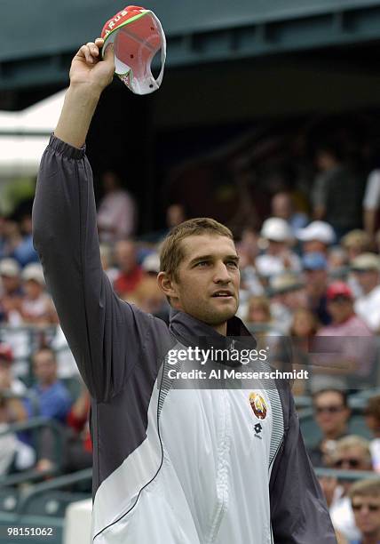 Max Mirnyi of Belarus waives to tennis fans during opening ceremonies at the 2004 David Cup semifinal September 24, 2004 at Daniel Island, South...