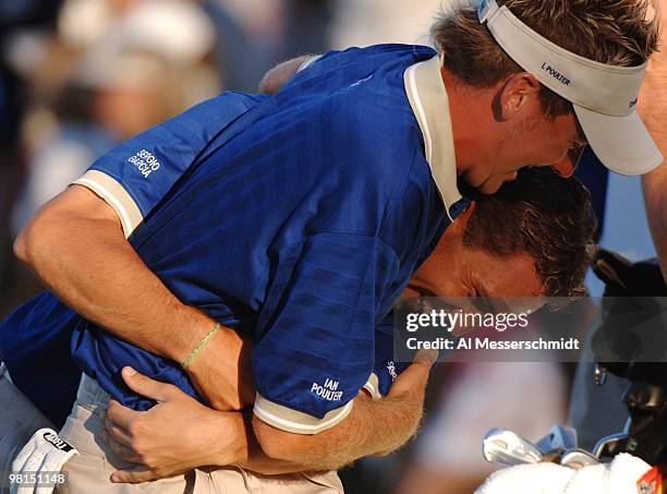 Ian Poulter and Sergio Garcia playfully wrestle after play in the 2005 Tavistock Cup at Isleworth Country Club March 29.