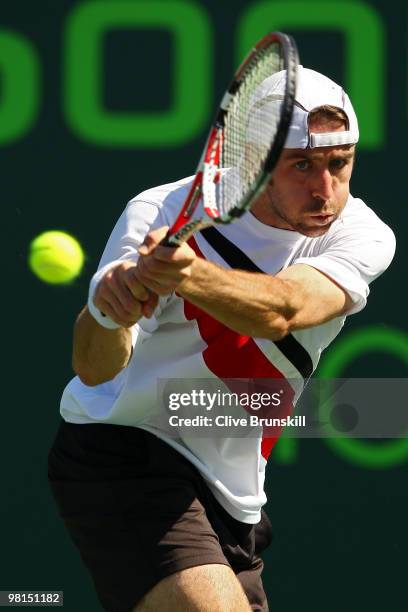 Benjamin Becker of Germany returns a shot against Andy Roddick of the United States during day eight of the 2010 Sony Ericsson Open at Crandon Park...