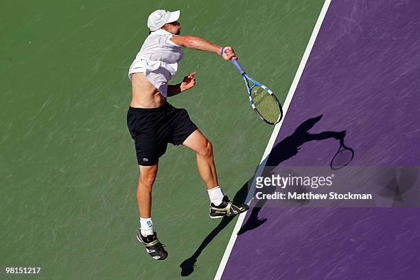 Andy Roddick of the United States serves against Benjamin Becker of Germany during day eight of the 2010 Sony Ericsson Open at Crandon Park Tennis...