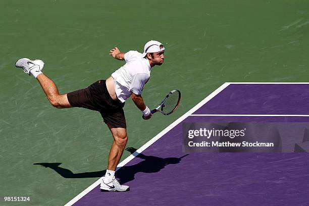 Benjamin Becker of Germany serves against Andy Roddick of the United States during day eight of the 2010 Sony Ericsson Open at Crandon Park Tennis...