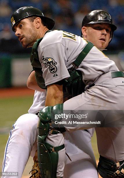 Oakland Athletics catcher Jason Kendall tags out Toby Hall at the plate against the Tampa Bay Devil Rays April 9, 2005 at Tropicana Field.