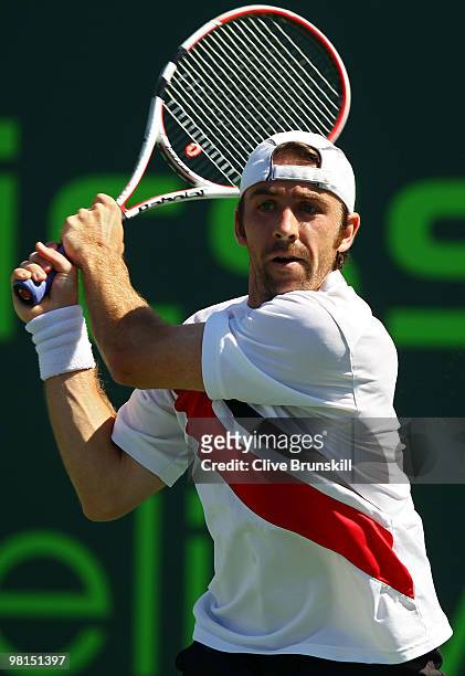 Benjamin Becker of Germany returns a shot against Andy Roddick of the United States during day eight of the 2010 Sony Ericsson Open at Crandon Park...