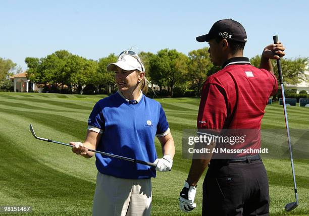 Tiger Woods and Annika Sorenstam warm up on the driving range before play in the 2005 Tavistock Cup at Isleworth Country Club March 29.