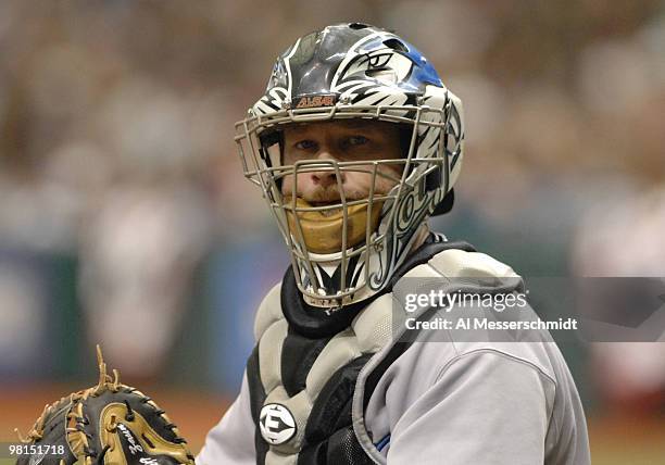 Toronto Blue Jays catcher Greg Zaun checks the signal from the dugout against the Tampa Bay Devil Rays, April 8, 2007 in St. Petersburg, Florida. The...