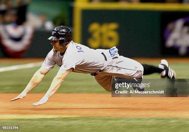 Toronto Blue Jays Reed Johnson dives into third base against the Tampa Bay Devil Rays April 7, 2007 in St. Petersburg. The Jays defeated the Rays 8 -...