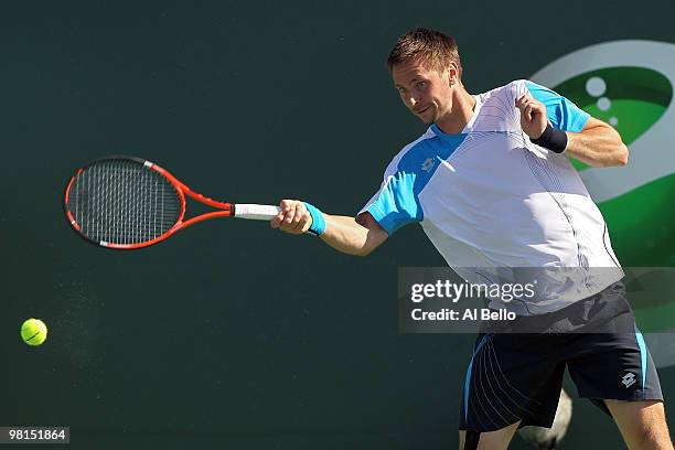 Robin Soderling of Sweden returns a shot against Fernando Gonzalez of Chile during day eight of the 2010 Sony Ericsson Open at Crandon Park Tennis...