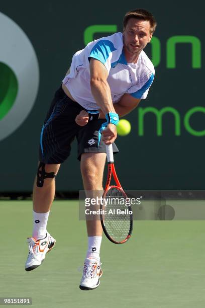 Robin Soderling of Sweden serves against Fernando Gonzalez of Chile during day eight of the 2010 Sony Ericsson Open at Crandon Park Tennis Center on...