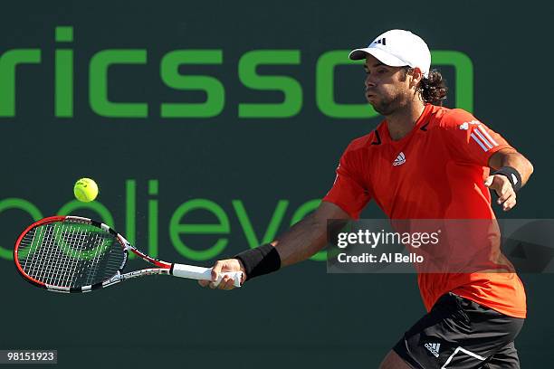Fernando Gonzalez of Chile returns a shot against Robin Soderling of Sweden during day eight of the 2010 Sony Ericsson Open at Crandon Park Tennis...
