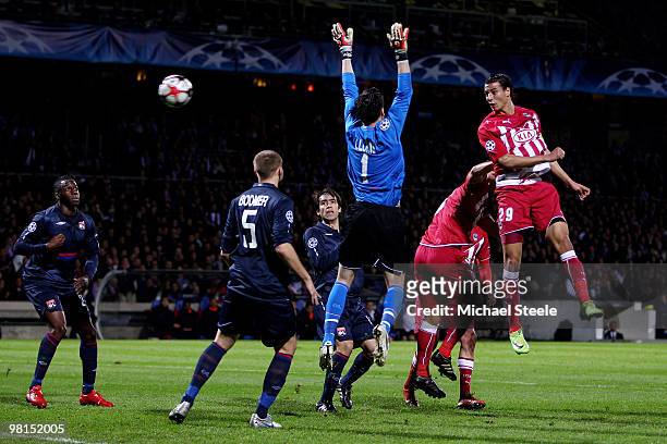 Marouane Chamakh of Bordeaux misses a chance with a header as Lyon goalkeeper Hugo lloris is stranded during the Lyon v Bordeaux UEFA Champions...