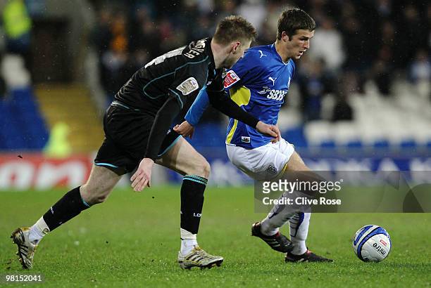Adam Matthews of Cardiff City is challenged by Paul Gallagher of Leicester City during the Coca Cola Championship game between Cardiff City and...