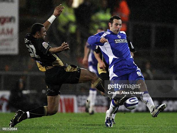 Leon Legge of Brentford tackles Pawel Abbott of Oldham Athletic during the Coca Cola League One match between Oldham Athletic and Brentford at...