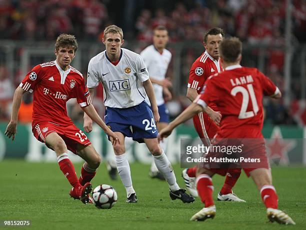 With Thomas Muller of Bayern Munich in action against Darren Fletcher of Manchester United during the UEFA Champions League Quarter-Final First Leg...