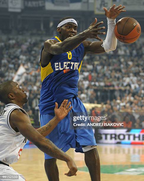 Doron Perkins of Maccabi Tel Aviv vies with Lester McCalebb of Partizan Belgrade during their teams third Euroleague quarterfinal match in Belgrade...