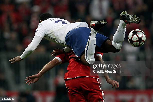 Patrice Evra of Manchester falls over Hamit Altintop of Muenchen during the UEFA Champions League quarter final first leg match between Bayern...