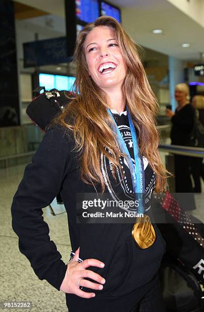 Vancouver 2010 Winter Olympics gold-medalist Torah Bright shows off her gold medal to the media after returning home with her gold medal at Sydney...