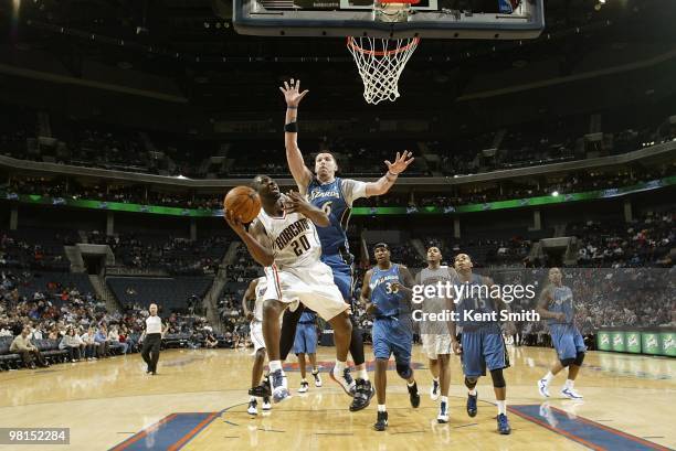 Raymond Felton of the Charlotte Bobcats lays up a shot against Mike Miller of the Washington Wizards during the game on February 9, 2010 at the Time...