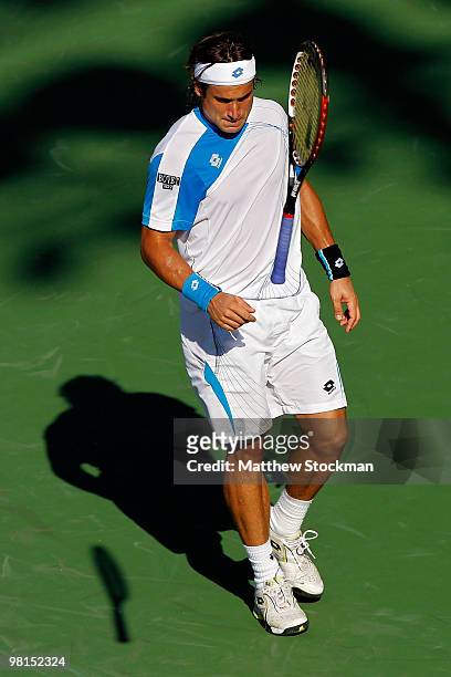 David Ferrer of Spain throws his racquet while playing Rafael Nadal of Spain during day eight of the 2010 Sony Ericsson Open at Crandon Park Tennis...