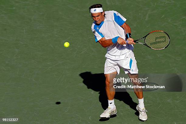 David Ferrer of Spain returns a shot against Rafael Nadal of Spain during day eight of the 2010 Sony Ericsson Open at Crandon Park Tennis Center on...