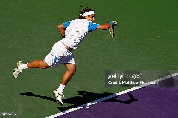 David Ferrer of Spain serves against Rafael Nadal of Spain during day eight of the 2010 Sony Ericsson Open at Crandon Park Tennis Center on March 30,...