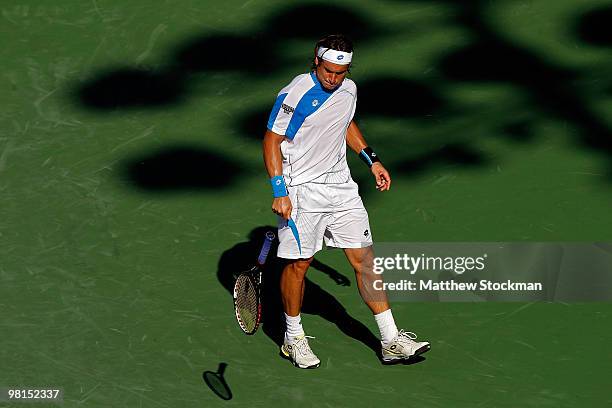 David Ferrer of Spain throws his racquet while playing Rafael Nadal of Spain during day eight of the 2010 Sony Ericsson Open at Crandon Park Tennis...