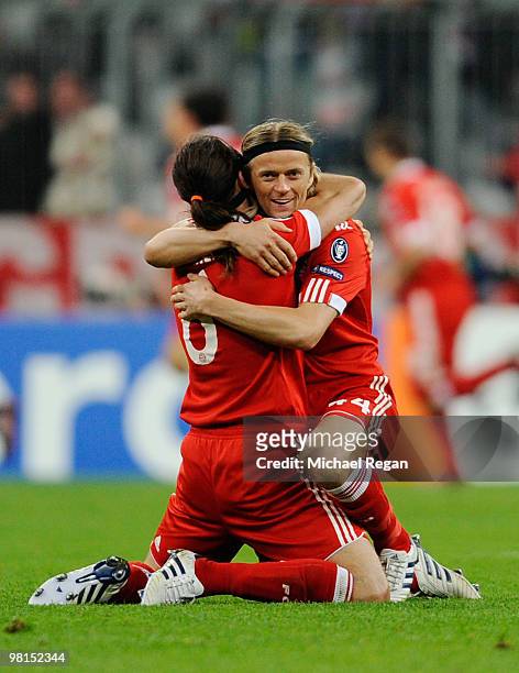Anatoliy Tymoschuk and Martin Gaston Demichelis of Bayern Muenchen celebrate after the UEFA Champions League quarter final first leg match between...