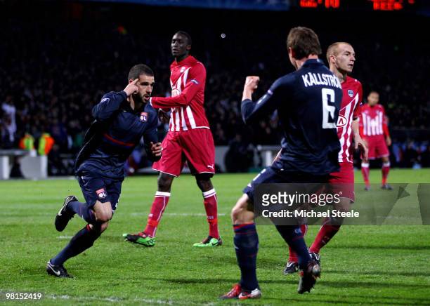 Lisandro of Lyon celebrates scoring the third goal during the Lyon v Bordeaux UEFA Champions League quarter-final 1st leg match at the Stade de...