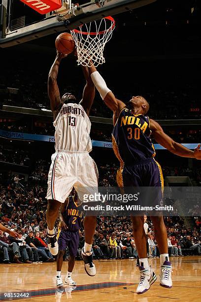 Nazr Mohammed of the Charlotte Bobcats shoots against David West of the New Orleans Hornets during the game on February 6, 2010 at the Time Warner...