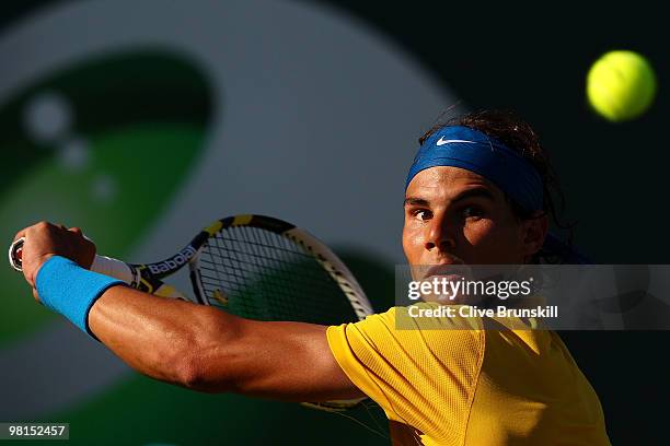 Rafael Nadal of Spain returns a shot against David Ferrer of Spain during day eight of the 2010 Sony Ericsson Open at Crandon Park Tennis Center on...