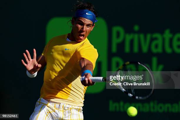 Rafael Nadal of Spain returns a shot against David Ferrer of Spain during day eight of the 2010 Sony Ericsson Open at Crandon Park Tennis Center on...