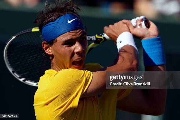 Rafael Nadal of Spain returns a shot against David Ferrer of Spain during day eight of the 2010 Sony Ericsson Open at Crandon Park Tennis Center on...